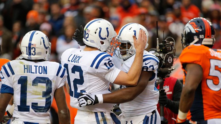 DENVER, CO - JANUARY 11:  Andrew Luck #12 and Dwayne Allen #83 of the Indianapolis Colts celebrate a second quarter touchdown against the Denver Broncos   