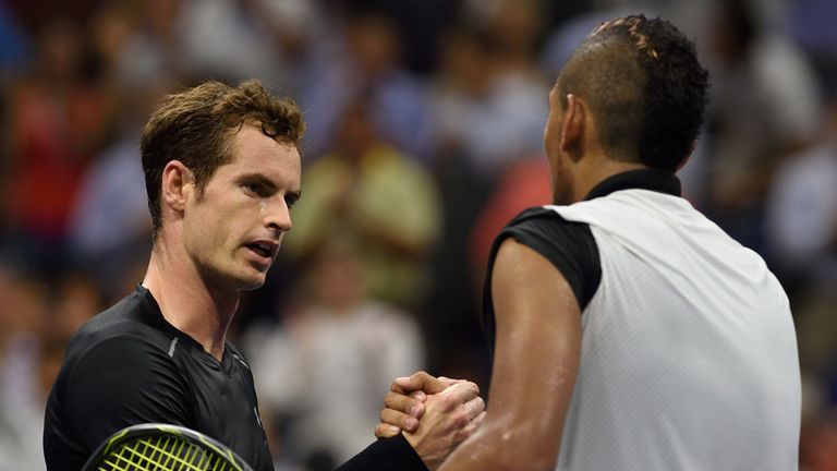 Andy Murray (L) of Great Britain meets Nick Kyrgios of Australia at the net after their US Open 2015 first round men's singles match at the USTA Billie Jea