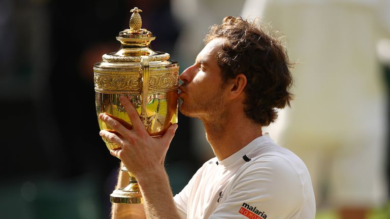 LONDON, ENGLAND - JULY 10:  Andy Murray of Great Britain kisses the trophy following victory in the Men's Singles Final against Milos Raonic of Canada on d