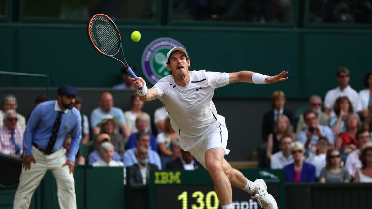 Andy Murray plays a forehand during the Men's Singles Quarter Finals match against Jo-Wilfried Tsonga of France, Wimbledon