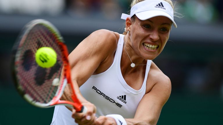 Germany's Angelique Kerber returns against Romania's Simona Halep during their women's singles quarter-final match on the ninth day of the 2016 Wimbledon C