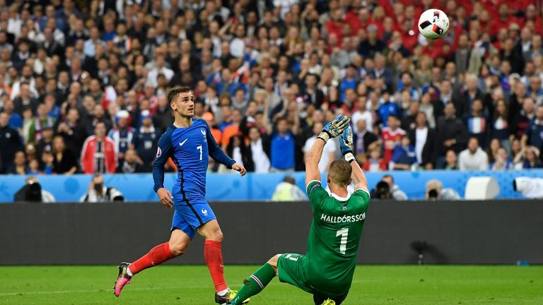 Antoine Griezmann (L) of France scores his team's fourth goal