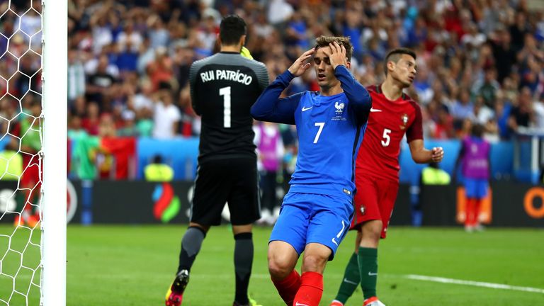 Antoine Griezmann of France reacts after missing