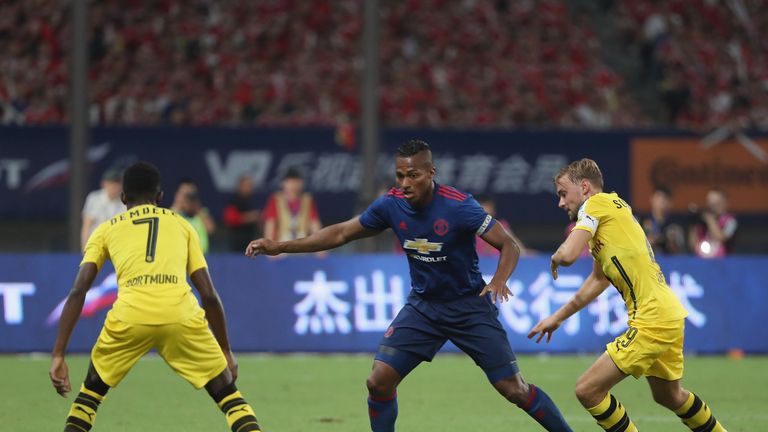 Antonio Valencia of Manchester United in action with Ousmane Dembele and Marcel Schmelzer of Borussia Dortmund, Shanghai friendly