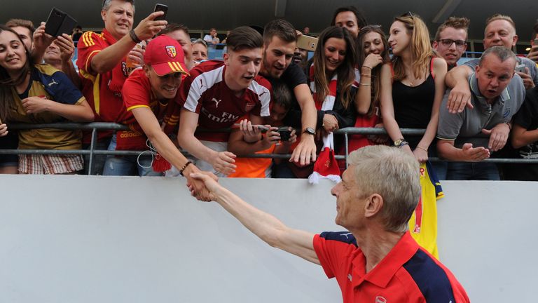 Arsene Wenger meets Arsenal fans before kick-off at the Stade Bollaert-Delelis