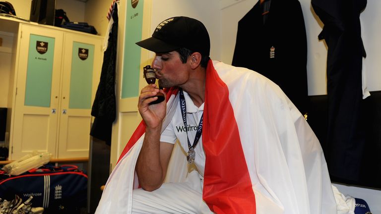 LONDON, ENGLAND - AUGUST 23:  England captain Alastair Cook celebrates with the ashes urn in the dressing rooms after the 5th Investec Ashes Test match bet