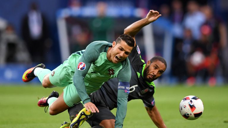 Ashley Williams of Wales tackles Cristiano Ronaldo of Portugal during the UEFA EURO 2016 semi final match in Lyon