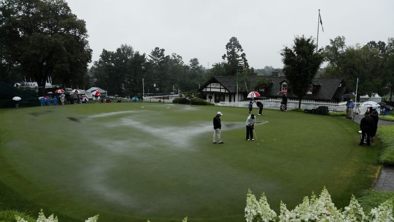 Louis Oosthuizen on the practice green in the rain during the second round of the 2016 PGA Championship