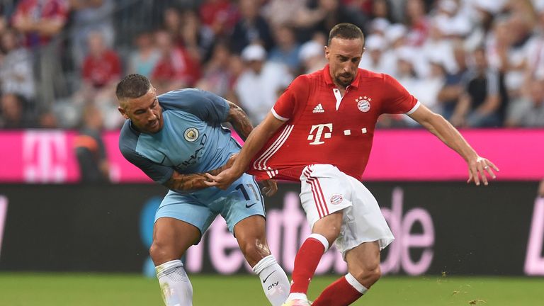 Bayern Munich's French midfielder Franck Ribery and Manchester's Serbian defender Aleksandar Kolarov vie for the ball during a friendly in July 2016