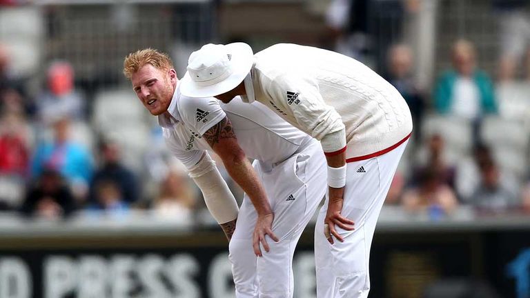 Stuart Broad (in hat) shows concern for his stricken team-mate Ben Stokes at Old Trafford
