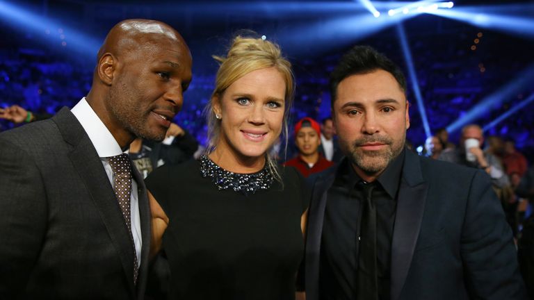 LAS VEGAS, NV - NOVEMBER 21:  Promoter/boxer Bernard Hopkins, UFC fighter Holly Holm and promoter Oscar De La Hoya pose before the Guillermo Rigondeaux and