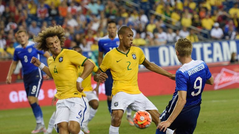 Brazil's David Luiz (4) and Brazil's Fabinho block a shot by USA's Aron Johannsson during the friendly match between the USA and Brazil September 8, 2015 a