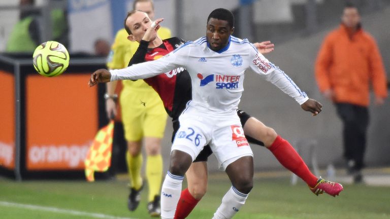 Guingamp's French midfielder Thibault Giresse (L) vies for the ball with Marseille defender Brice Dja Djedje  (R)