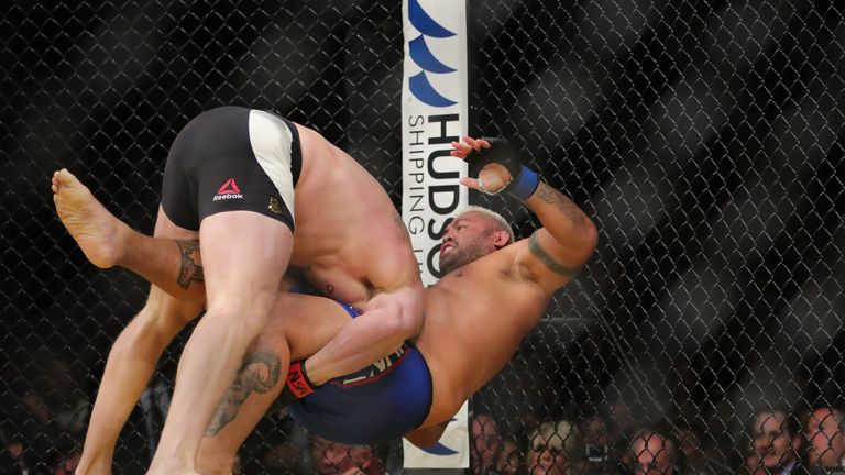 LAS VEGAS, NV - JULY 9: Brock Lesnar takes down Mark Hunt (R) during the UFC 200 event at T-Mobile Arena on July 9, 2016 in Las Vegas, Nevada. (Photo by Re