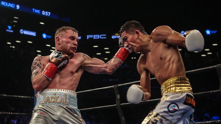 NEW YORK, NY - JULY 30:  Leo Santa Cruz of Mexico (gold trunks) fights Carl Frampton of Northern Ireland (blue trunks) during their  12 round WBA Super  fe