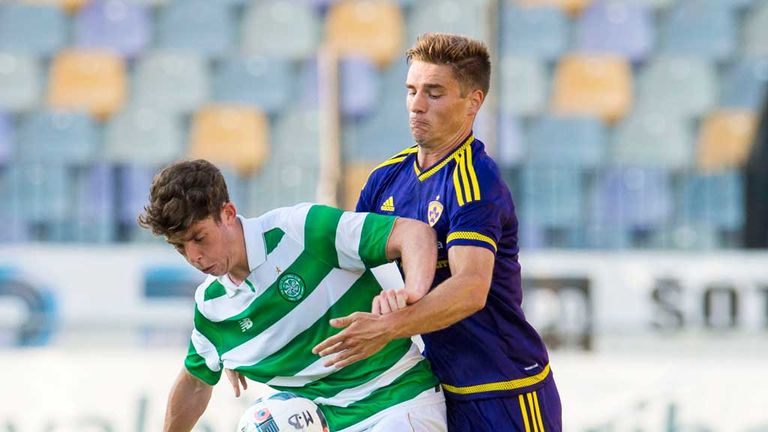 Celtic's Ryan Christie (left) battles for the ball against Marbior's Blaz Vrhovec