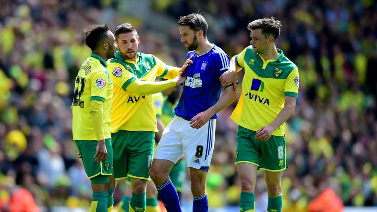 NORWICH, ENGLAND - MAY 16:  Nathan Redmond of Norwich City (22) and Cole Skuse of Ipswich Town clash during the Sky Bet Championship Playoff semi final sec