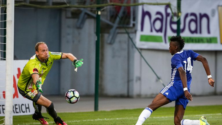 Chelsea's Bertrand Traore scores a goal against goalkeeper Alexander Kofler of RZ Pellets WAC.