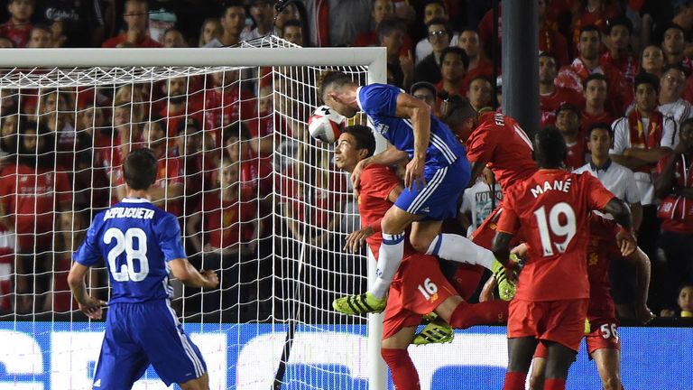 Defender Gary Cahill of Chelsea heads the opening goal