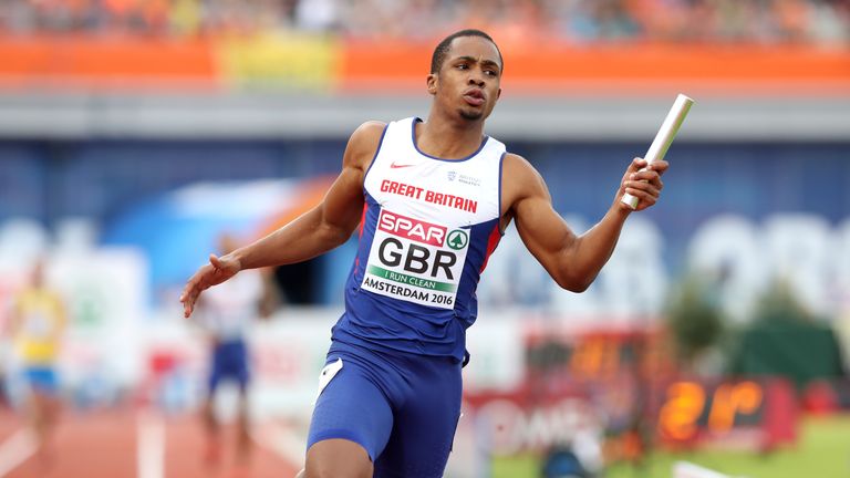 Great Britain's Chijindu Ujah finishes the fourth leg to win their men's 4x100 relay qualifying round 