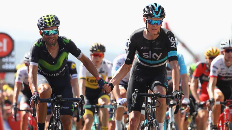 Chris Froome (R) of Great Britain and Team Sky shakes hands with Alejandro Valverde (L) of Spain and Movistar after cro