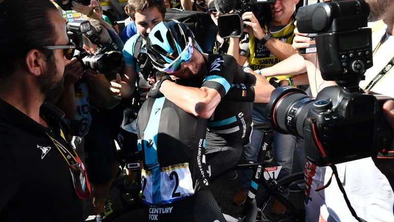 Great Britain's Christopher Froome celebrates with a teammate after crossing the finish line of the 184 km eighth stage of the 103rd edition of the Tour de