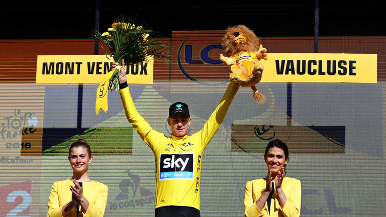 MONTPELLIER, FRANCE - JULY 14:  Chris Froome of Great Britain riding for Team Sky is presented with the yellow leaders jersey on the podium at stage twelve