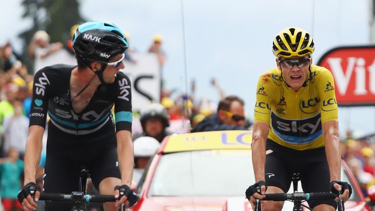 SAINT-GERVAIS MONT BLANC, FRANCE - JULY 22:  Yellow Jersey leader Chris Froome of Great Britain and Team Sky is helped to the finish line by team mate Wout