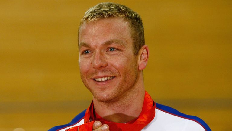 Chris Hoy with the three gold medals he won at the Beijing 2008 Olympics