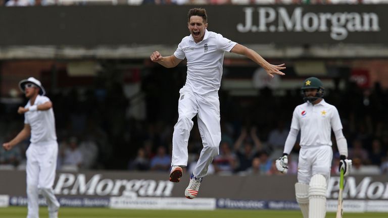 Chris Woakes celebrates taking the wicket of Shan Masood for 24 runs