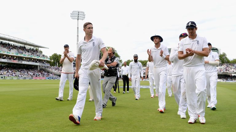 LONDON, ENGLAND - JULY 16:  Chris Woakes of England leads his team from the field on stumps on day three of the 1st Investec Test between England and Pakis