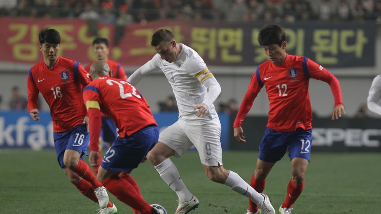 SEOUL, SOUTH KOREA - MARCH 31 2015:  Christopher Wood of New Zealand compete for the ball with Han Kyo-Won of South Korea