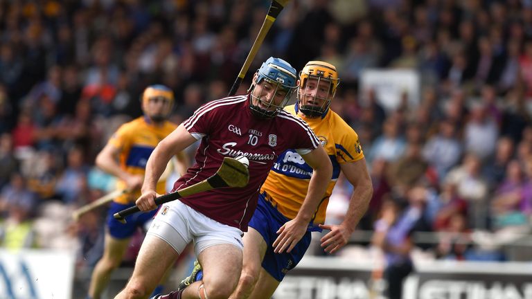 Conor Cooney goes past Cian Dillon of Clare on his way to scoring his Galway's first goal 