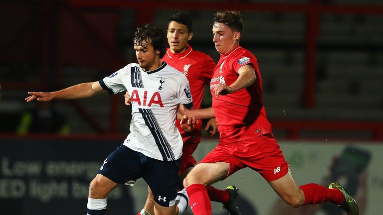 STEVENAGE, ENGLAND - OCTOBER 23:  Filip Lesniak of Tottenham Hotspur and Conor Masterson of Liverpool challenge for the ball during the Barclays U21 Premie