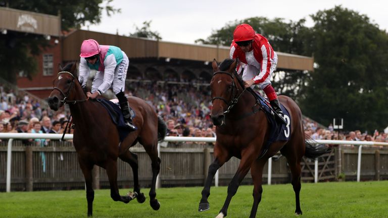 Dabyah ridden by Frankie Dettori (right) goes on to win The Rossdales EBF Stallions Maiden Fillies' Stakes during the Darley July Cup Day of The Moet & Cha