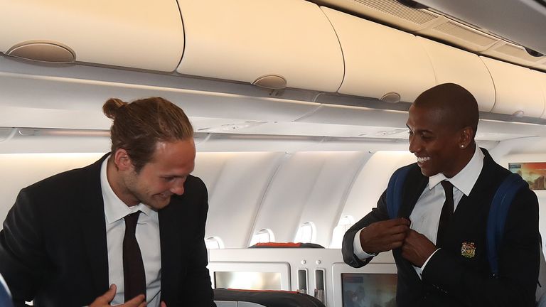 Daley Blind and Ashley Young board the plane ahead of Manchester United's pre-season tour to China