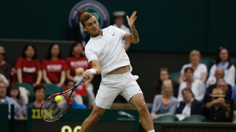 Britain's Daniel Evans returns to Switzerland's Roger Federer during their men's singles third round match on the fifth day of the 2016 Wimbledon Champions