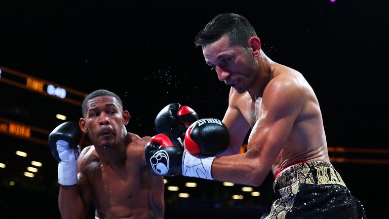 NEW YORK, NY - AUGUST 01:  Danny Jacobs (L) exchanges punches with Sergio Mora during their middleweight bout at Barclays Center on August 1, 2015 in Brook