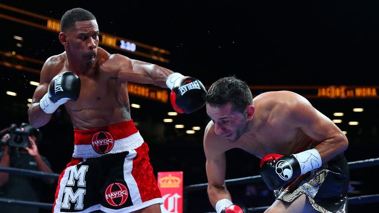 NEW YORK, NY - AUGUST 01:  Danny Jacobs (L) exchanges punches with Sergio Mora during their middleweight bout at Barclays Center on August 1, 2015 in Brook