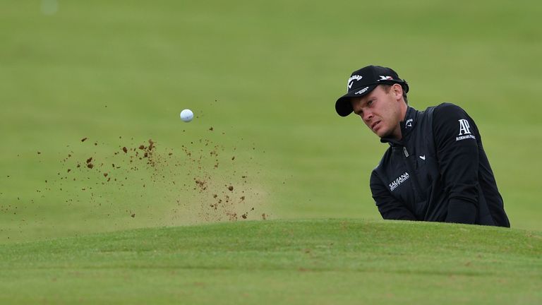 England's Danny Willett plays from a bunker on the 1st hole during practice on July 11, 2016, ahead of the 2016 British Open Golf Championship at Royal Tro