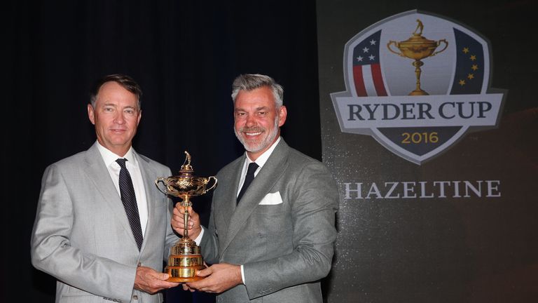 CHASKA, MN - SEPTEMBER 29:  (L-R) Davis Love III, US Ryder Cup Captain and Darren Clarke, European Ryder Cup Captain pose with the trophy following the 201