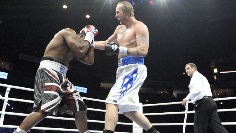 Finland's Robert Helenius (R), "the Nordic Nightmare", fights with Great Britain's Dereck Chisora, "Del Boy", during their heavyweight class European Champ