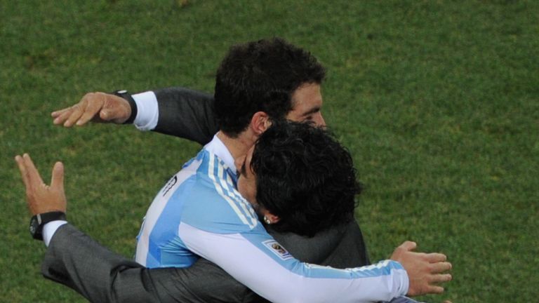 Argentina's coach Diego Maradona hugs Argentina's striker Gonzalo Higuain during the 2010 World Cup round of 16 football match Argentina vs. Mexico on June