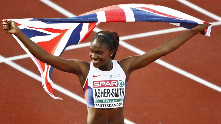 Britain's Dina Asher-Smith celebrates with the British flag after winning the women's 200m final race during the European Athletics Championships on July 7