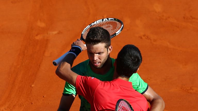MONTE-CARLO, MONACO - APRIL 13:  Jiri Vesely of the Czech Republic embraces Novak Djokovic of Serbia following their second match on day four of the Monte 