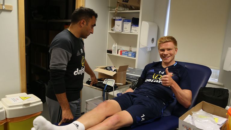 Duncan Watmore gets checked over by Sunderland club doctor Ish Rehman during the first day of pre-season training
