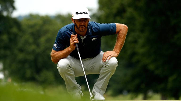 AKRON, OH - JULY 03: Dustin Johnson lines up a putt on the second green during the final round of the World Golf Championships - Bridgestone Invitational a