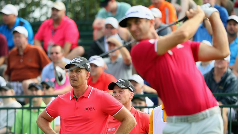 Henrik Stenson and Danny Willett watch Dustin Johnson during the second round of the PGA Championship