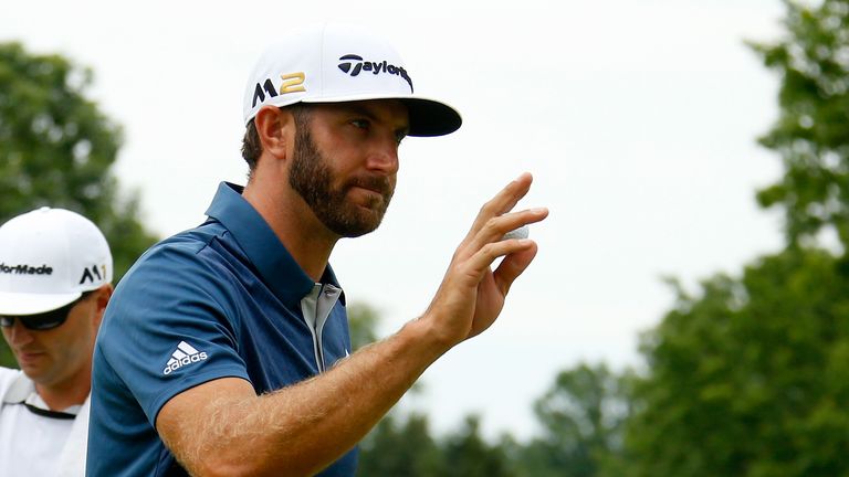 AKRON, OH - JULY 03:  Dustin Johnson reacts after a birdie on the 17th green during the final round of the World Golf Championships - Bridgestone Invitatio