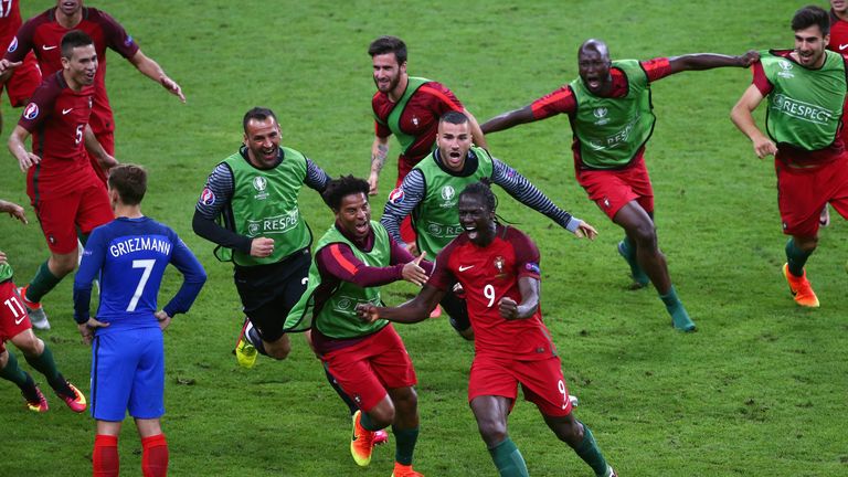 Eder (C) of Portugal is chased by jubilant team-mates after his extra-time strike against France in the Euro 2016 final